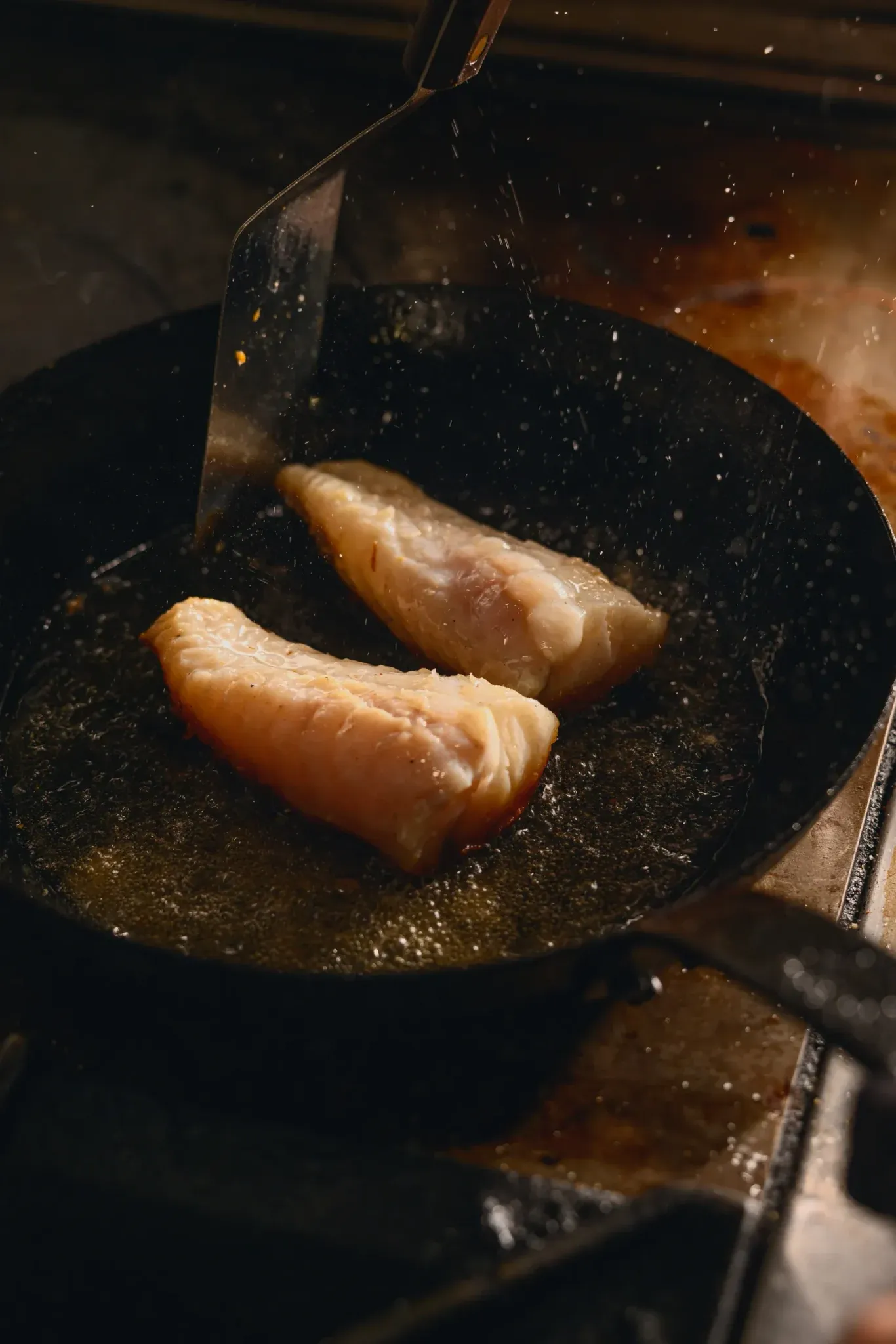 Monkfish searing in a pan at Salt, The Ritz-Carlton Amelia Island