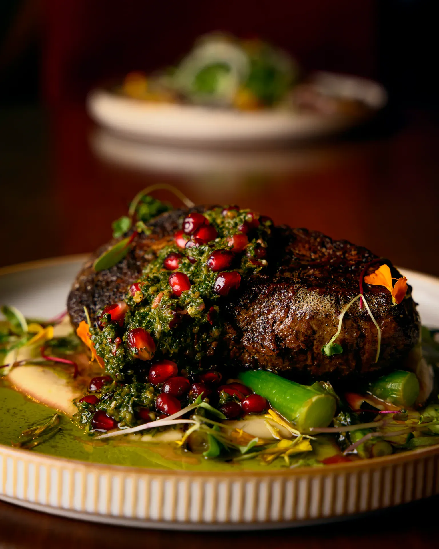 Plated steak with chimichurri and pomegranate at Petronita's, Jacksonville